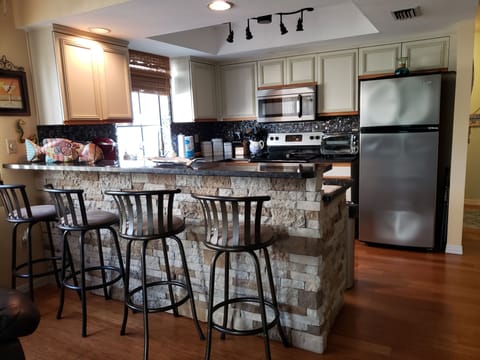 The kitchen bar sits four