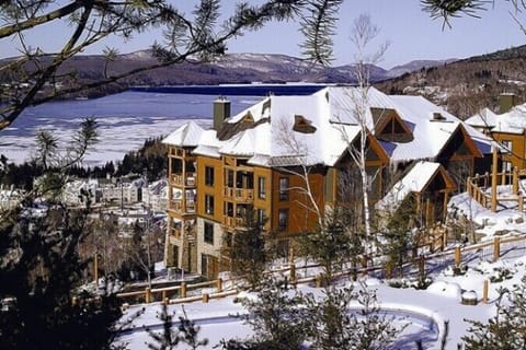 Exterior view of building - Equinoxe West.  View of Lake & Pedestrian Village.