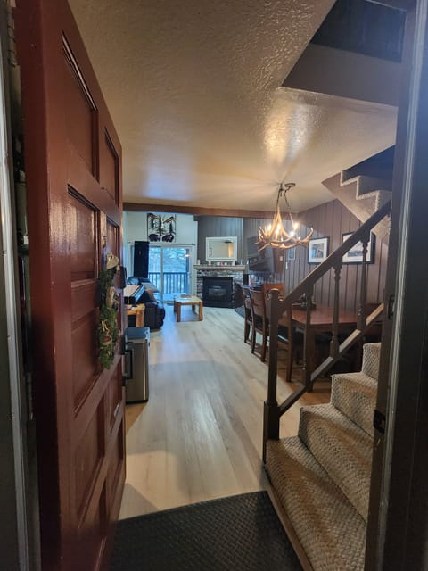 View of living room and dining table from front door