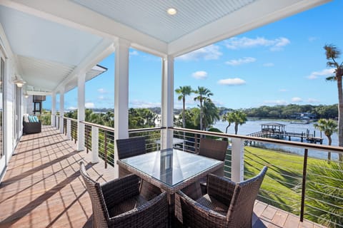 3rd floor balcony has plenty of seating and a table for outdoor dining.