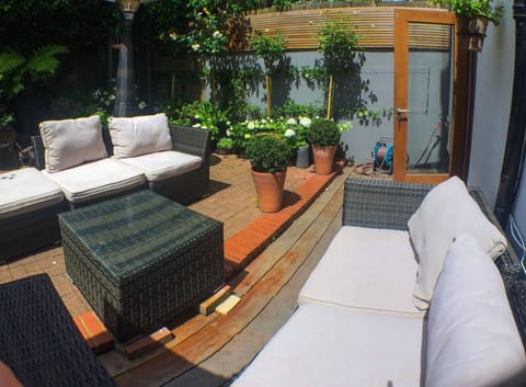 Lovely private outdoor patio garden, with heater, outdoor sofas and bbq
