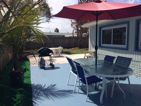 Lots of outdoor space, big grill, outdoor table with umbrella and extra seating.