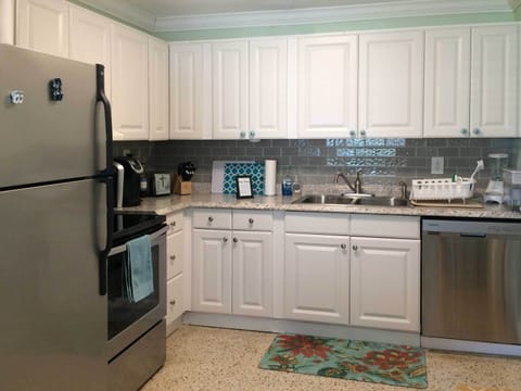 fully stocked and clean kitchen with stainless appliances, keurig, toaster, etc