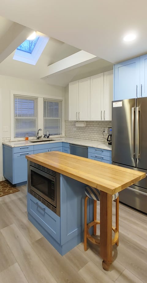 Cottage A Kitchen Island with microwave.