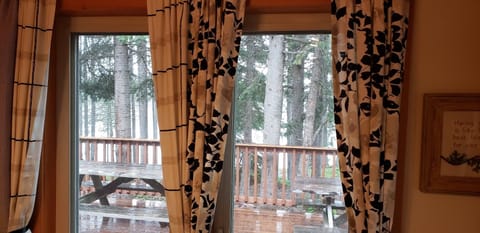 Dining room looks over large deck