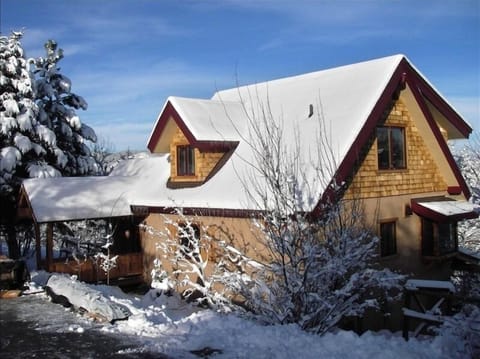 Snowy winter view of Chalet entrance, easy in easy out flat parking