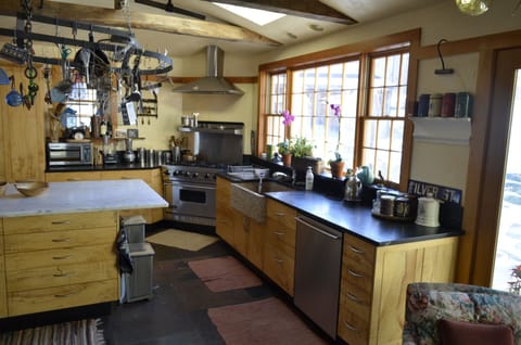 Kitchen space, just off entrance and sunroom. Fully stocked. Gas stove. 