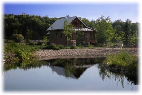 Charming guest house next to private pond and beach for sunning and camp fires