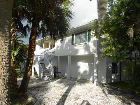 Sunlit front balcony 
at NO rEGRETS. Note the guests secure garage.