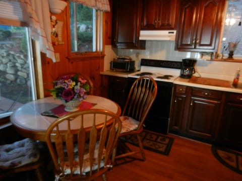 Kitchen with table chairs and stove area