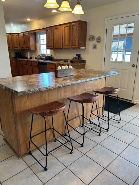 Extra seating can be found at the convenient island.