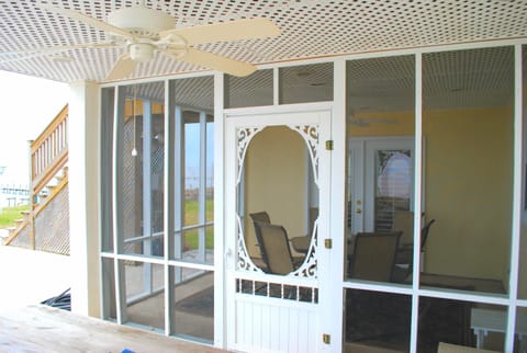 Screened in patio with table and chairs; seats six.