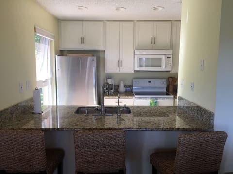 New kitchen with eat at counter top. Fully stocked larder. Everything you need