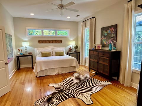 Primary Bedroom. King tempurpedic bed. Beautiful hardwood floors.