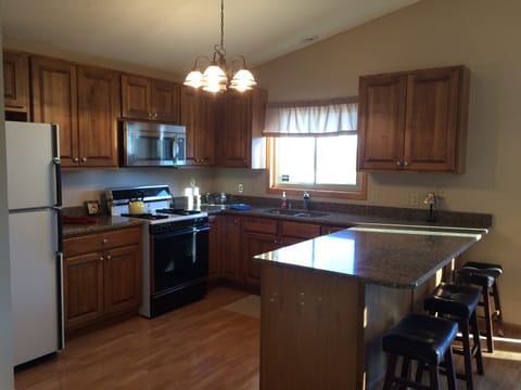 Kitchen with new cabinets and granite countertops.  