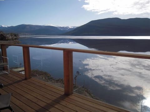 Looking north from top deck at the mountains reflected in the lake.