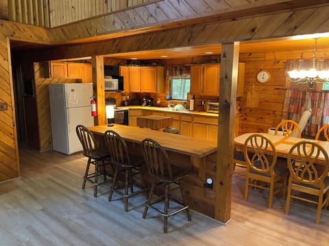 Kitchen, Bar, and Dining Area