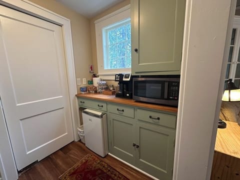 Kitchenette with mini-fridge; microwave; coffee pot; dishes; supplies