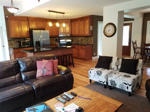 gather in the open kitchen, living and dining room