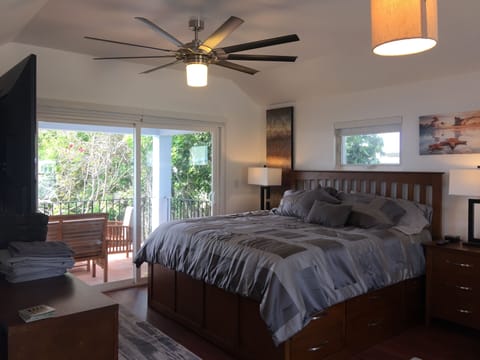King Size bed under a King Size whisper quiet Fan, drawers for storage