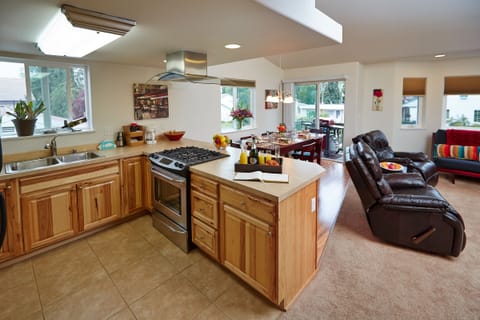 Open floor plan with kitchen, dining room, and living room.