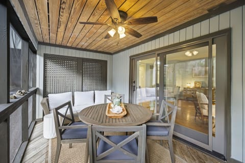 Screened-In Patio With Dining Table, Outdoor Sofa and Nature Views