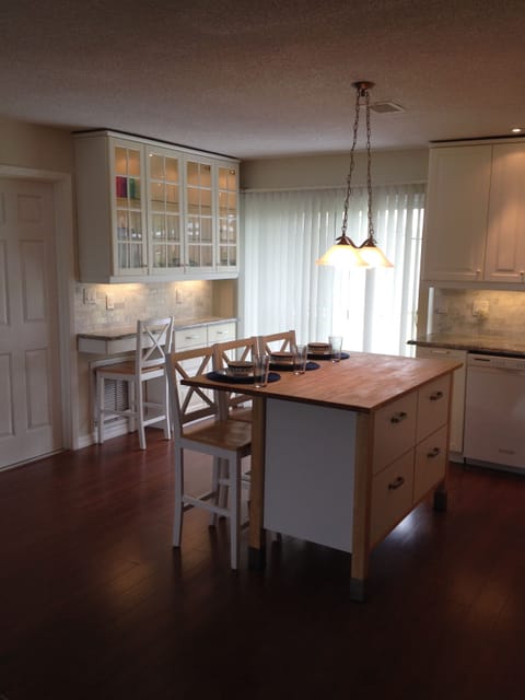 Kitchen/dining area with additional seating available. 