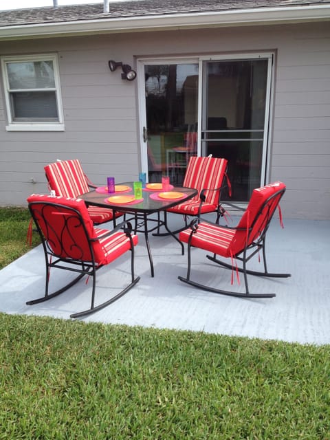 rear patio with gas grill provided.