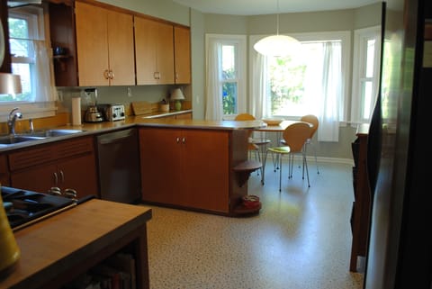 The kitchen looks out on the backyard