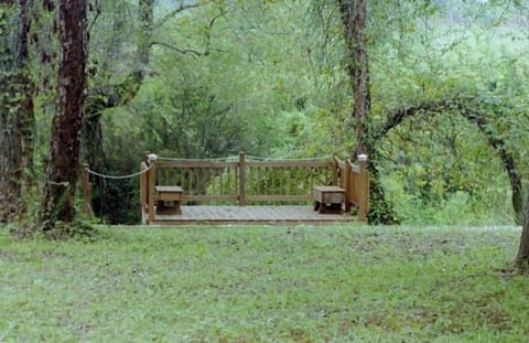 Lot on the Nottley River with deck and benches, stairs to the river.