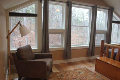 Window wall in bedroom that over looks the forest