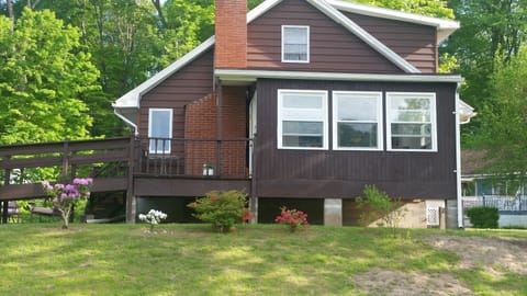 Back of house , view from water and yard (3 windows are the porch)