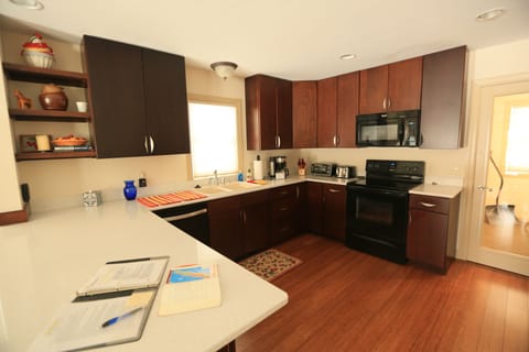 Functional kitchen, fully stocked for cooking and eating