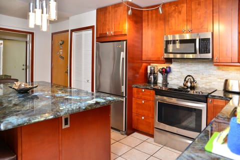 Master suite is beside the kitchen to the right and the Queen suite to the left 