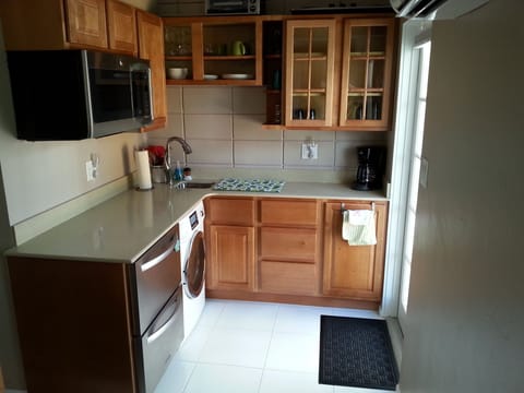 Fridge, freezer, washer, dryer and multi-purpose GE oven.