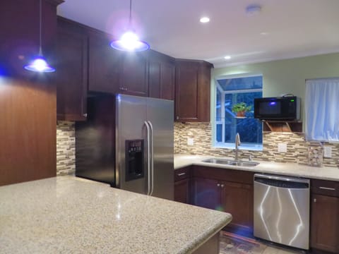 Kitchenette 2nd Level with Beautiful Granite Counters and Glass Tile Backsplash