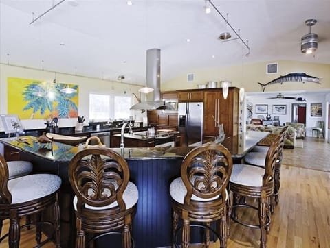 Cook's kitchen and bar. Casa Encantada features an open living area.