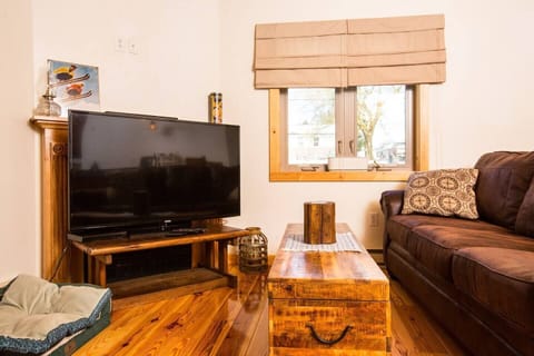 Comfy living room with sofa and rocking chair. WiFi, Smart TV, streaming provided. 