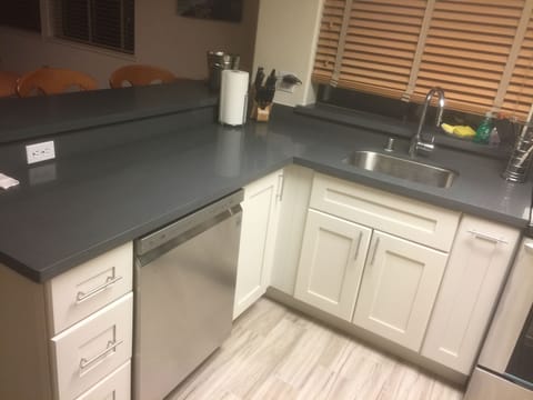 slab quartz countertops, stainless steel appliances