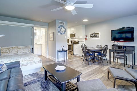 Living room with full size Murphy bed open - Beachy Vibes