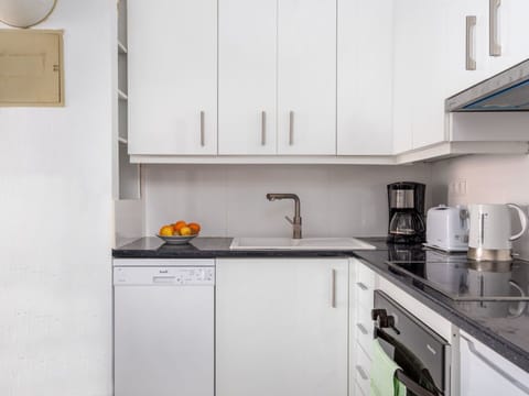 Kitchen, Room, Cabinetry, Countertop, Property, Furniture, Interior Design, Yellow, Major Appliance, House