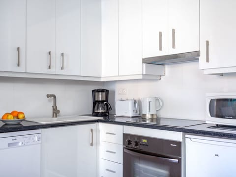 Countertop, Kitchen, Room, White, Cabinetry, Property, Furniture, Major Appliance, Kitchen Stove, Yellow