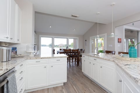 Views of the lake from the Kitchen that has 2 bar stools to sit and enjoy coffee