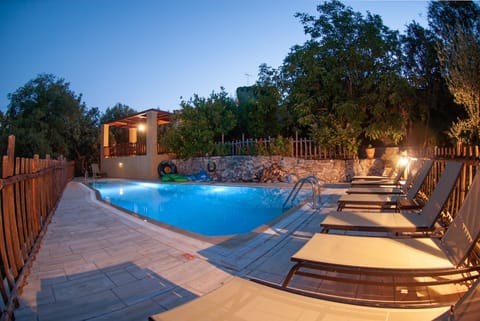 pool in the night overlooked form tour pergola with amazing views