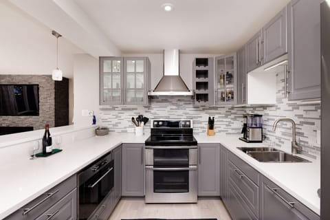 Brand new kitchen with double sink, dishwasher, quartz counters & coffee maker