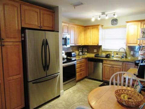 Kitchen has regular coffee maker plus Keurig