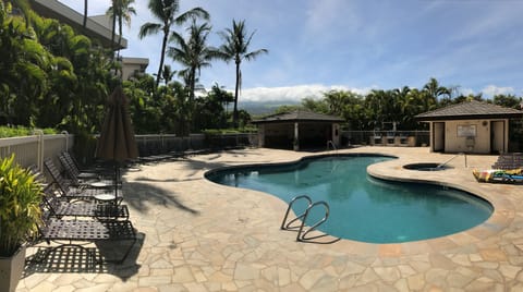 One of 2 lovely heated pools and spa with BBQ grills and seating