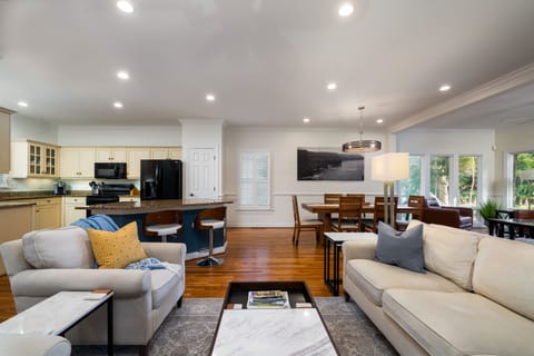 The main living spaces all open to each other letting the whole family be together whether cooking, dining, or relaxing