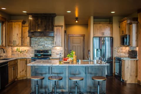 Kitchen with two ovens, two dishwashers, a second refrigerator in the garage.