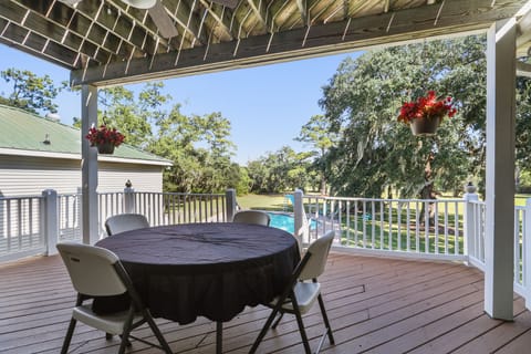 rear porch with view of grounds